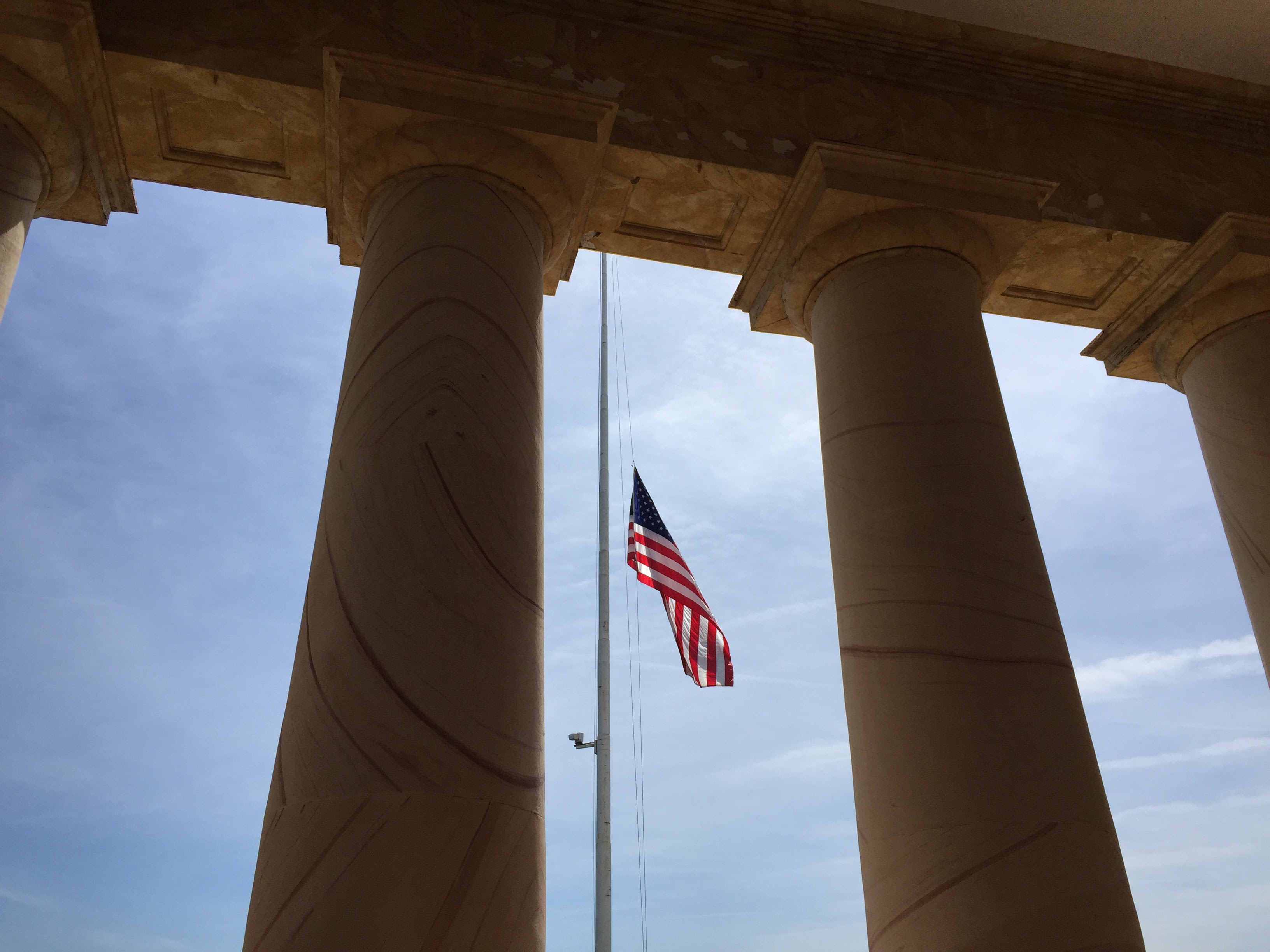 American flag between pillars